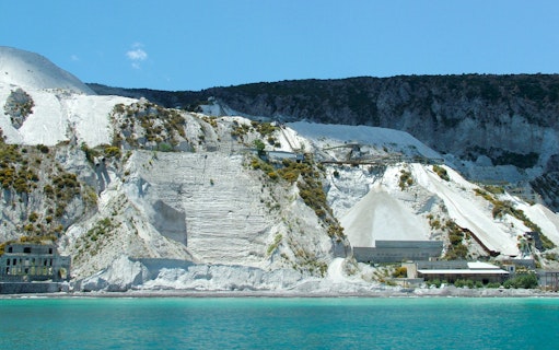 Lipari pumice cliffs viewed from the sea on a boat tour to Salina.