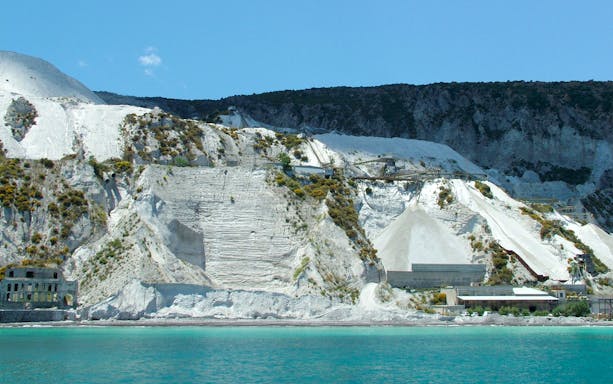 Lipari pumice cliffs viewed from the sea on a boat tour to Salina.