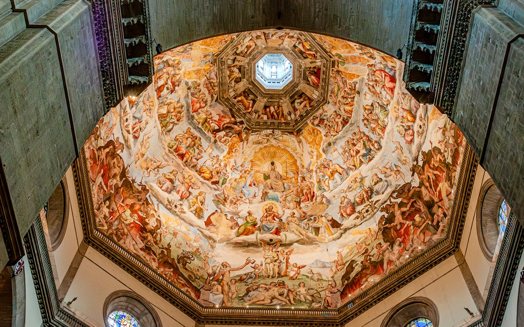 Frescoes inside Florence Duomo's dome during guided tour with cupola climb.