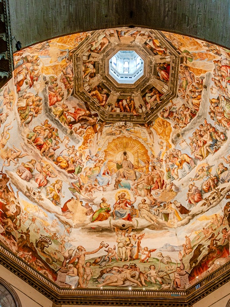 Frescoes inside Florence Duomo's dome during guided tour with cupola climb.