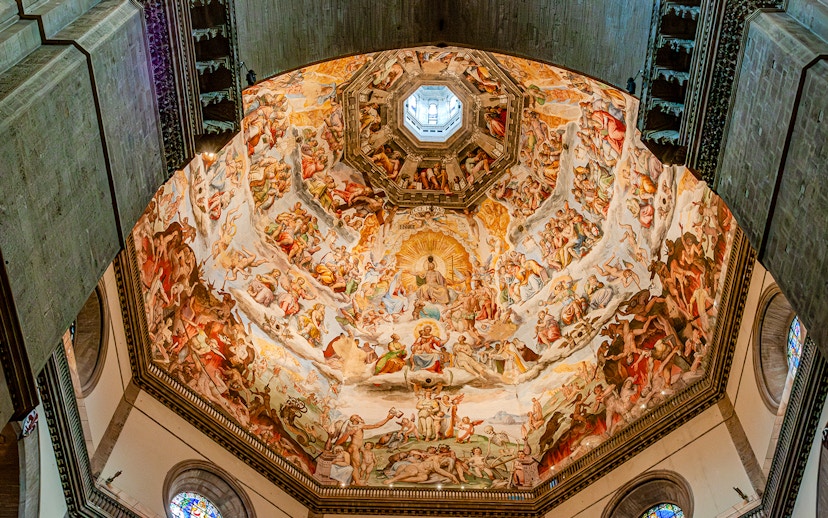 Frescoes inside Florence Duomo's dome during guided tour with cupola climb.