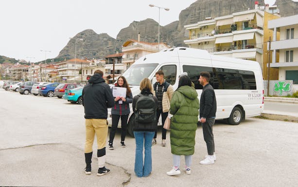 Meteora rock formations with monasteries, part of full-day tour from Athens including transfers.