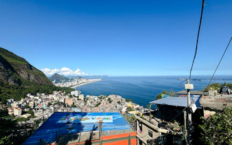 Panoramic view of Vidigal favela and coastline in Rio de Janeiro.