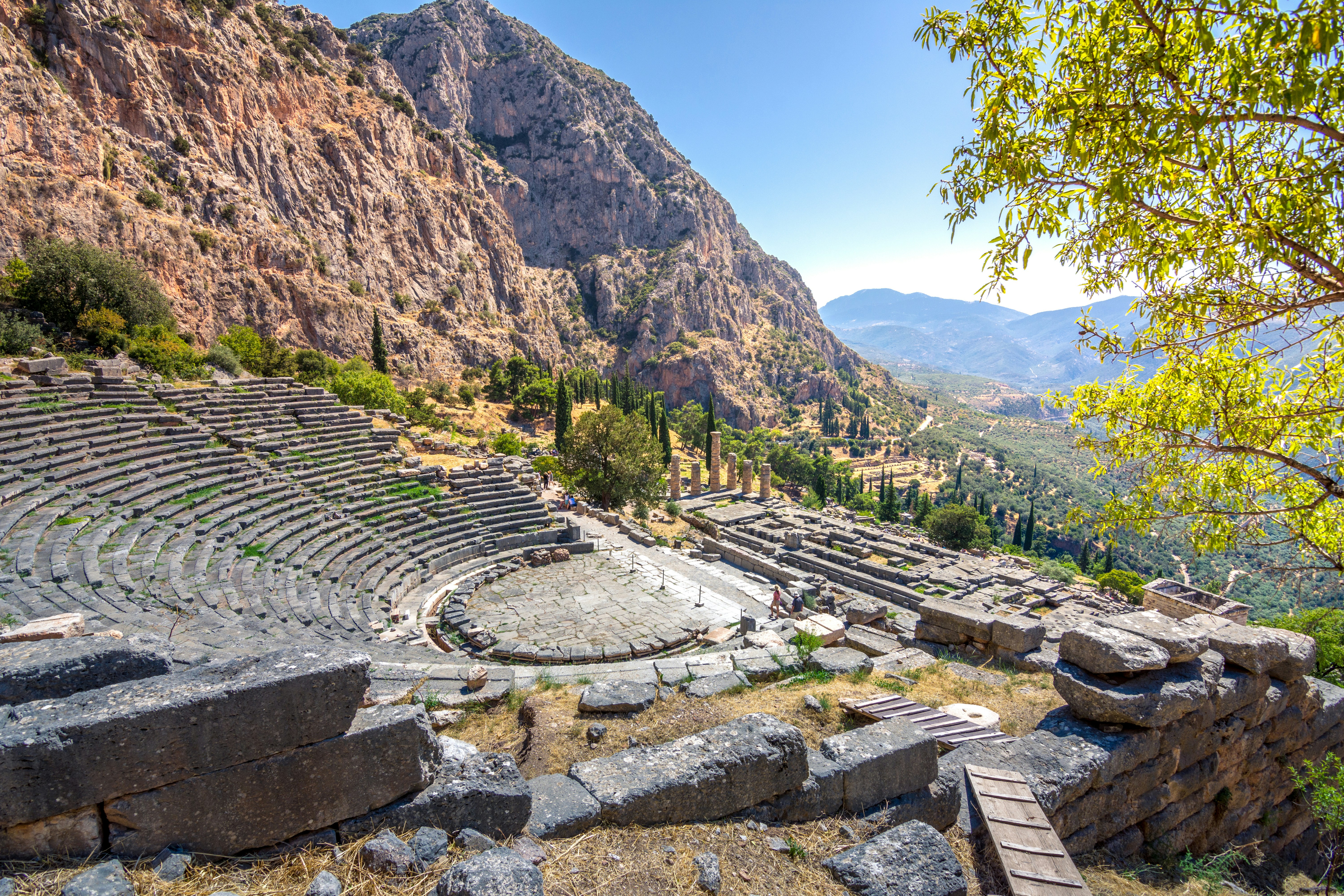 Ancient Theater of Delphi with mountainous backdrop in Greece.