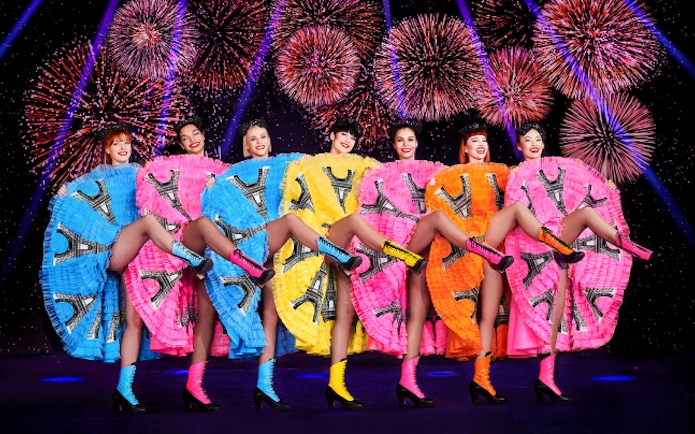 Paradis Latin cabaret show in Paris with performers on stage.