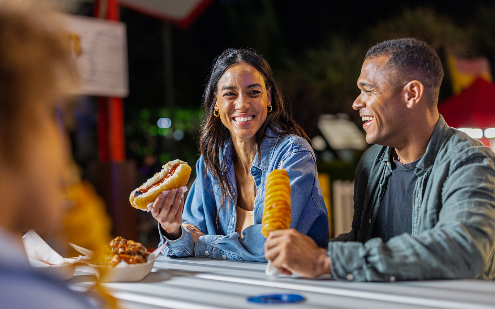 Dreamworld Gold Coast night market with vibrant stalls and visitors exploring local crafts and street food.