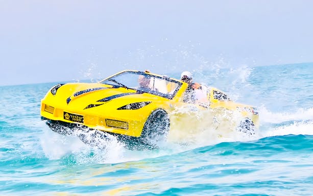 Couple riding jet car in Dubai