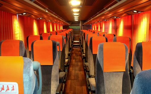 Bus interior for Narita Airport transfers to Shinjuku, T-CAT, and YCAT in Tokyo.