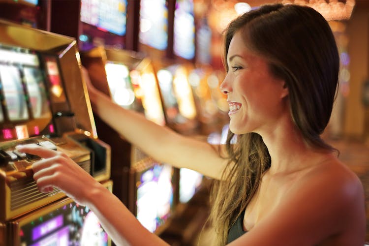 Asian woman gambling in casino