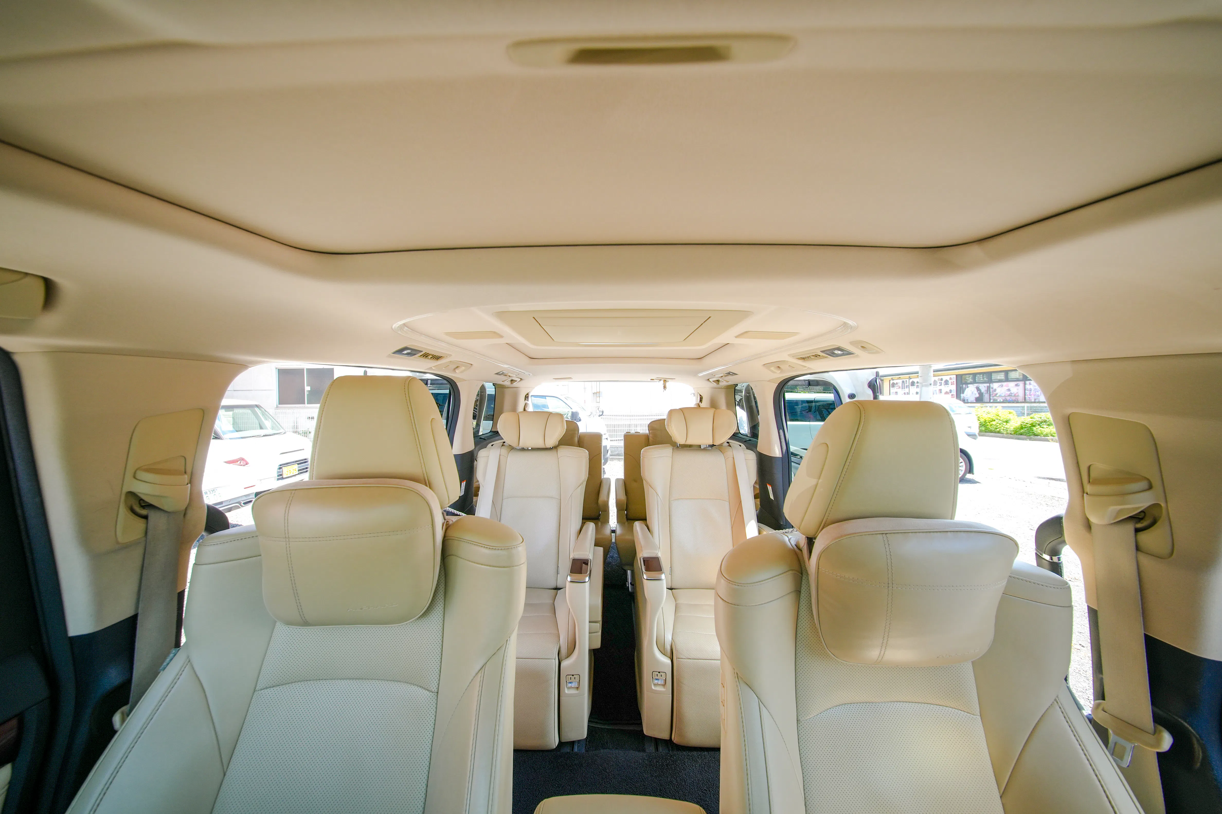 Interior of a luxury Alphard vehicle for private transfer from Kansai Airport to Kyoto, seating up to five.