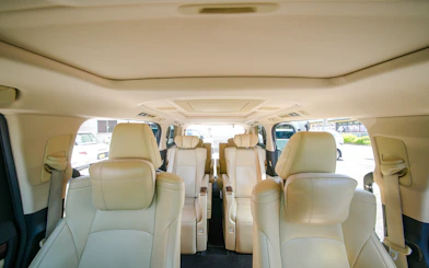 Interior of a luxury Alphard vehicle for private transfer from Kansai Airport to Kyoto, seating up to five.