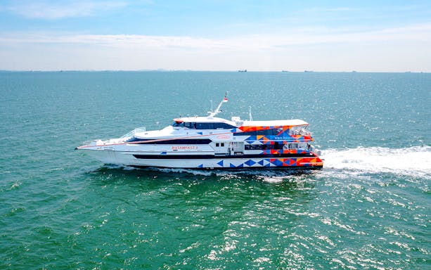 Ferry traveling from Singapore to Batam across the sea.