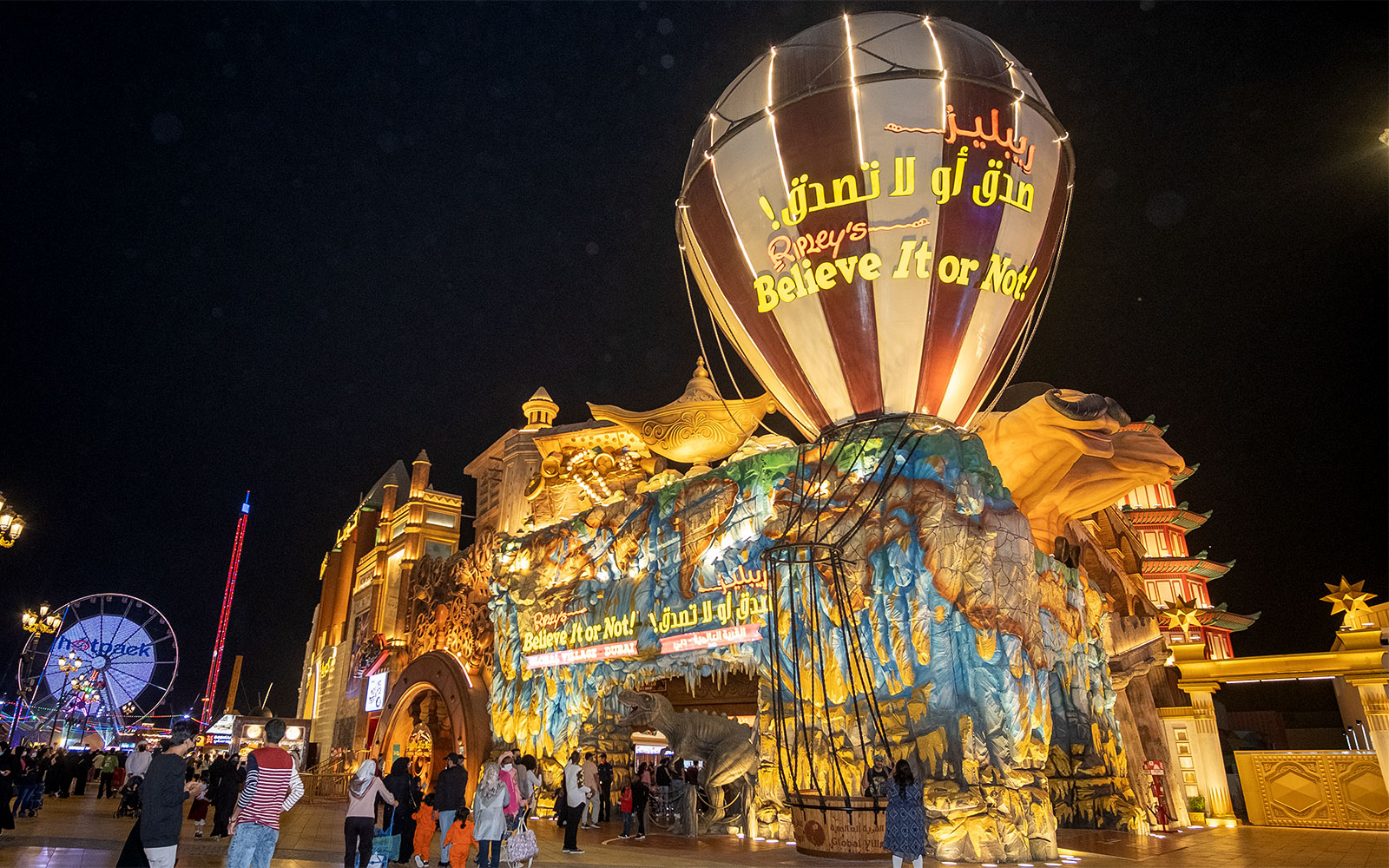 Ripley's Believe It or Not! attraction at Global Village, Dubai, with visitors exploring at night.