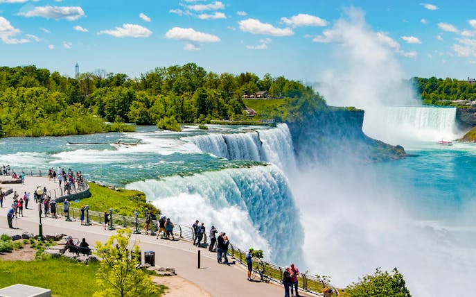 Visitors viewing Niagara Falls from the USA side during an evening tour.