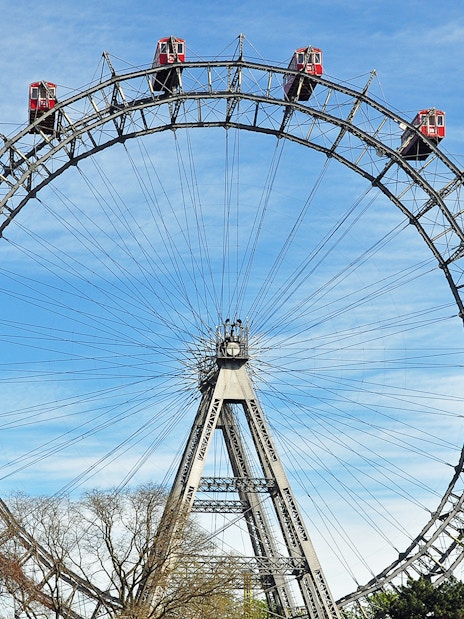 Tourists on the Giant Ferris Wheel in Vienna, part of the Hop-On Hop-Off Bus Tour package.
