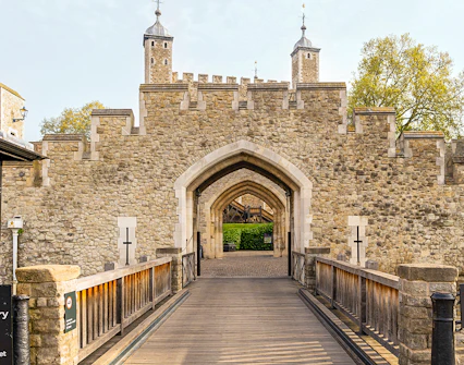 Entrance gate and stone walls of the Tower of London, England.