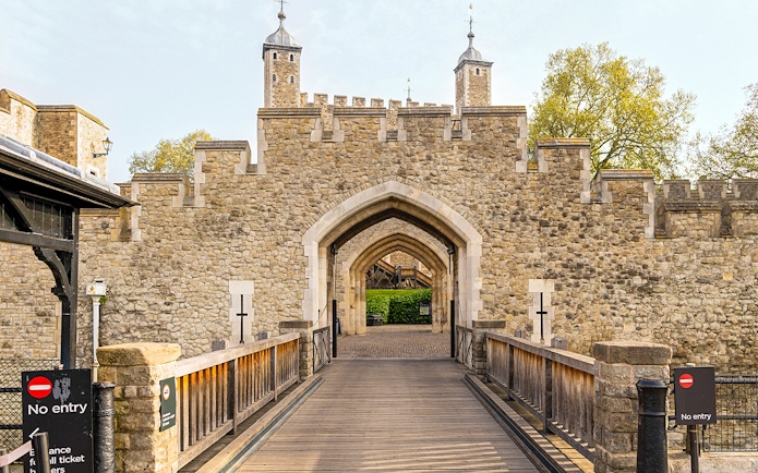 Entrance gate and stone walls of the Tower of London, England.