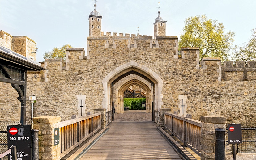 Entrance gate and stone walls of the Tower of London, England.