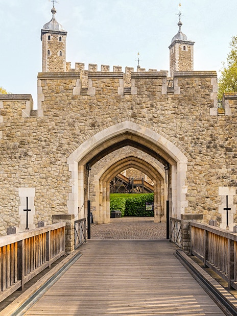 Entrance gate and stone walls of the Tower of London, England.