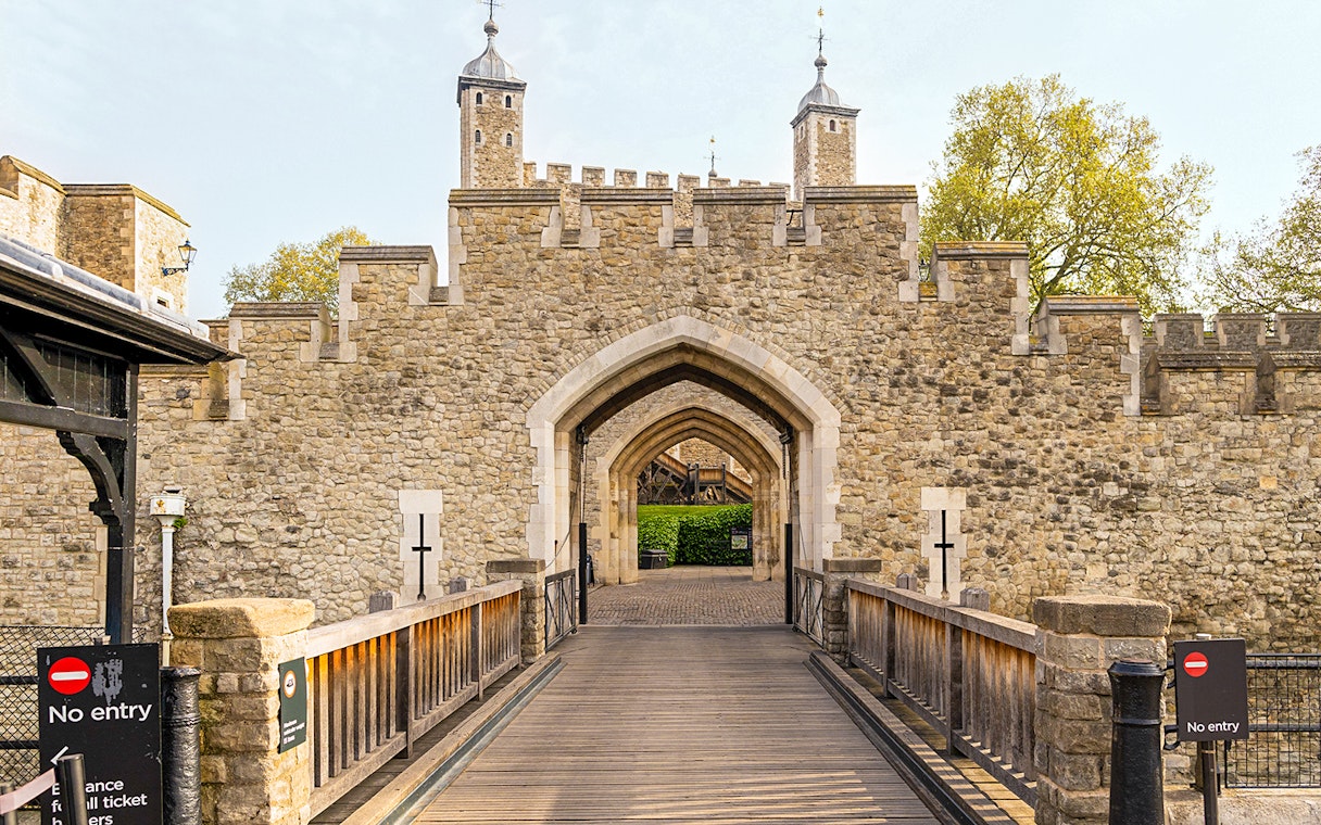 Entrance gate and stone walls of the Tower of London, England.