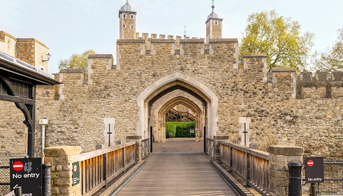 Entrance gate and stone walls of the Tower of London, England.