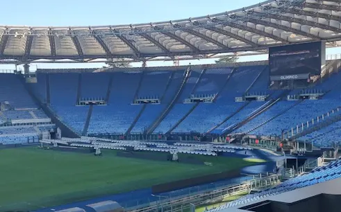 Olympic Stadium in Rome with empty blue seats, part of the city audio guide tour.