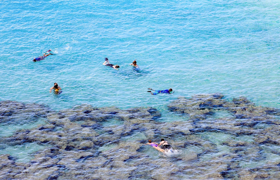 People swimming in the Hanauma Bay Natural Preserve, Hawaii