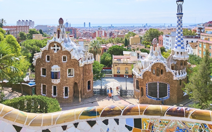 Park Güell entrance with mosaic buildings in Barcelona, Spain.