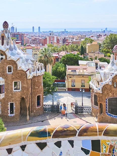Park Güell entrance with mosaic buildings in Barcelona, Spain.