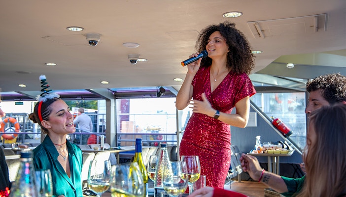 Vocalist performing for guests on a Christmas cruise.