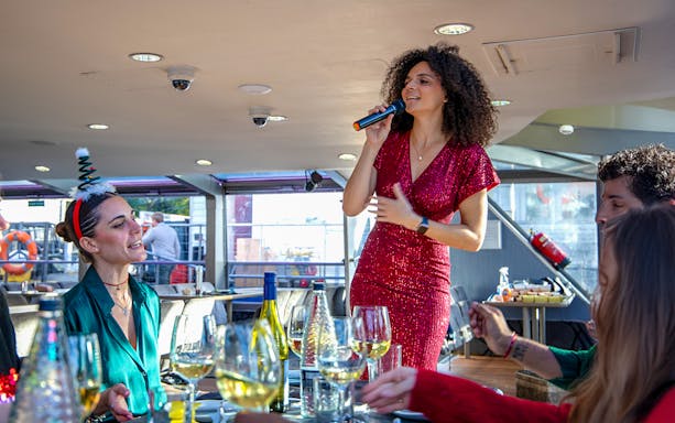 Vocalist performing for guests on a Christmas cruise.