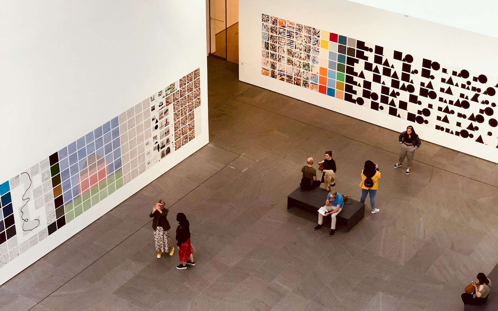 Visitors viewing artwork at Museum of Modern Art NYC.