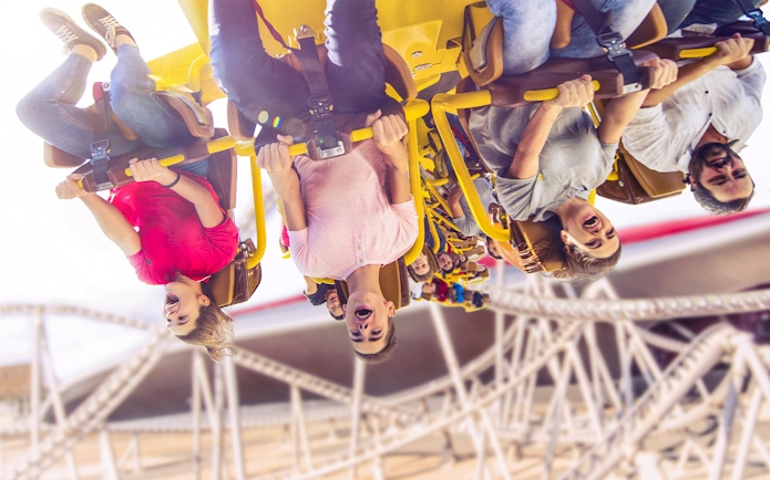 People enjoying Flying Aces ride at Ferrari World, Abu Dhabi.