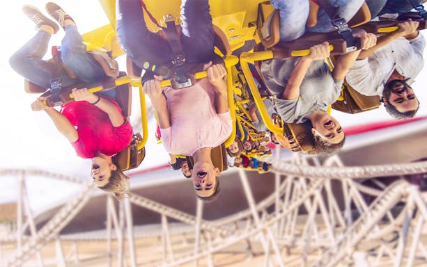 People enjoying Flying Aces ride at Ferrari World, Abu Dhabi.
