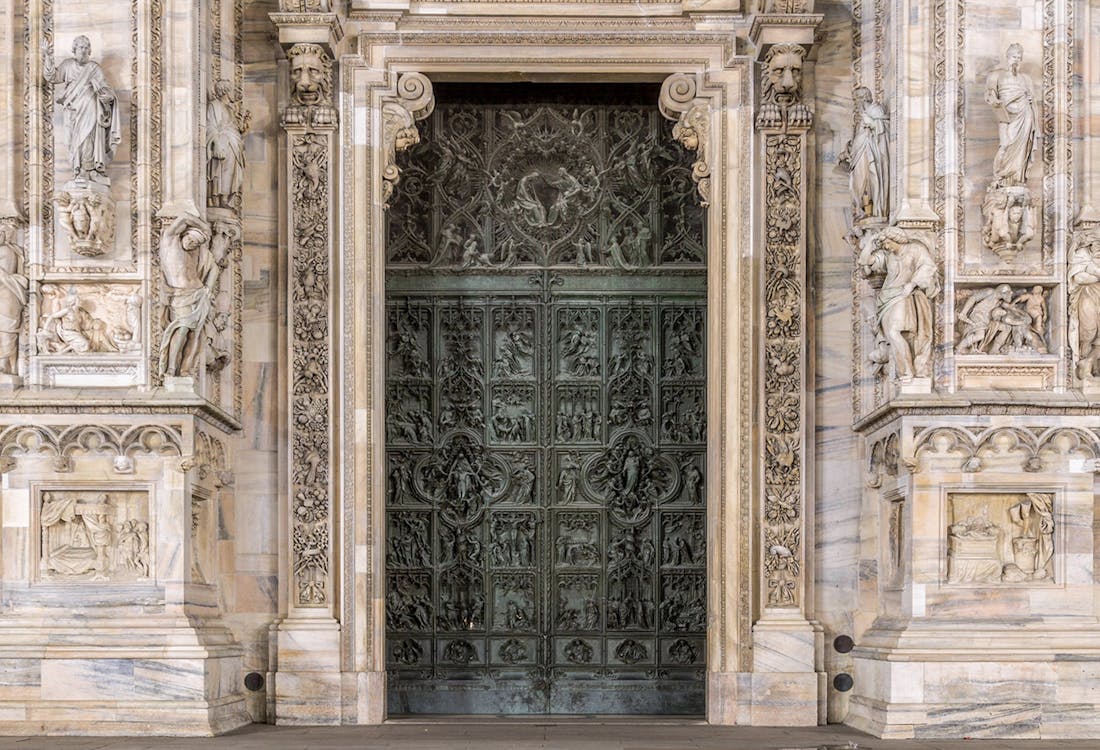 Accademia Gallery entrance in Florence with visitors waiting for a guided tour.