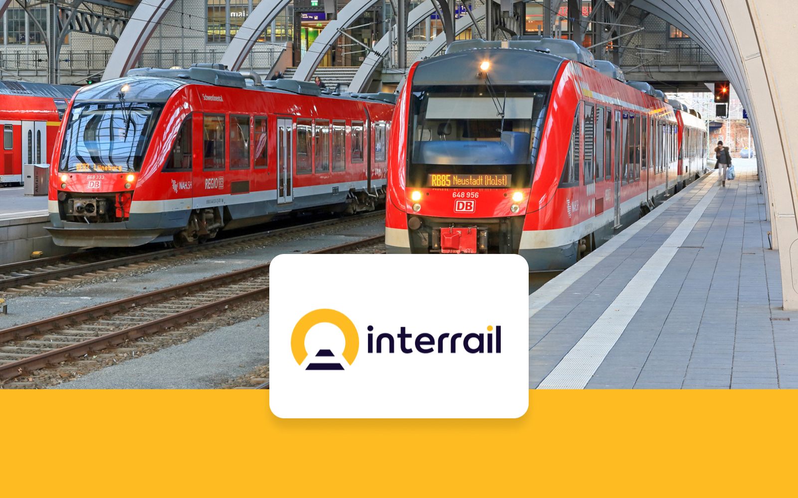 Interrail train at German station platform with Interrail logo.
