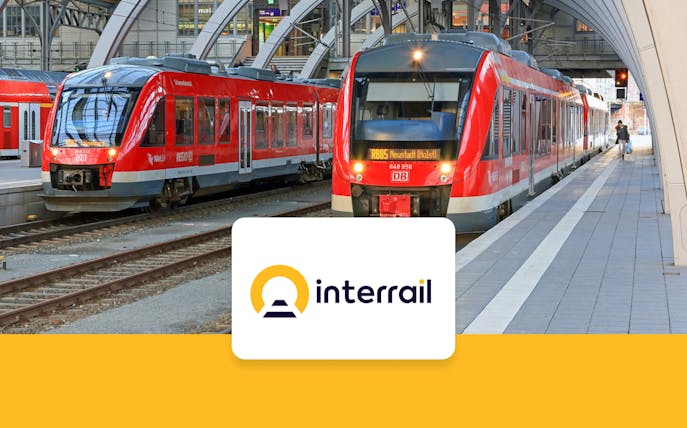 Interrail train at German station platform with Interrail logo.