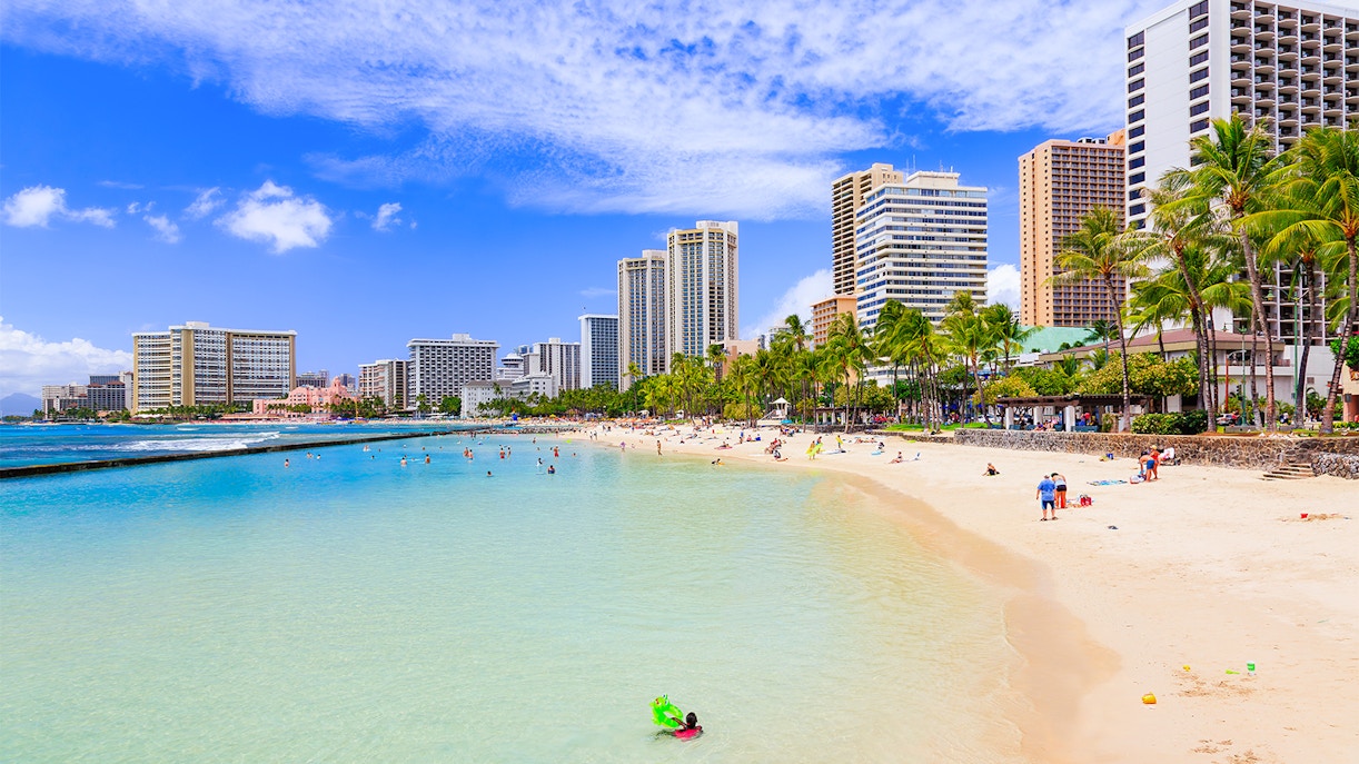 Waikiki Beach with Honolulu skyline in the background, Honolulu, Hawaii.