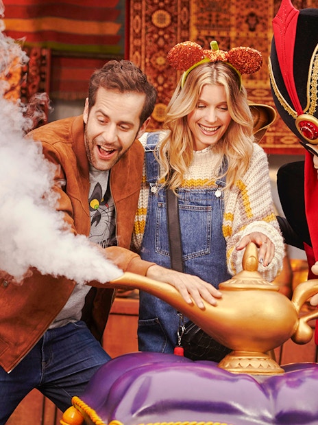 Guests interacting with Jafar at Disneyland Paris with Halloween decorations.