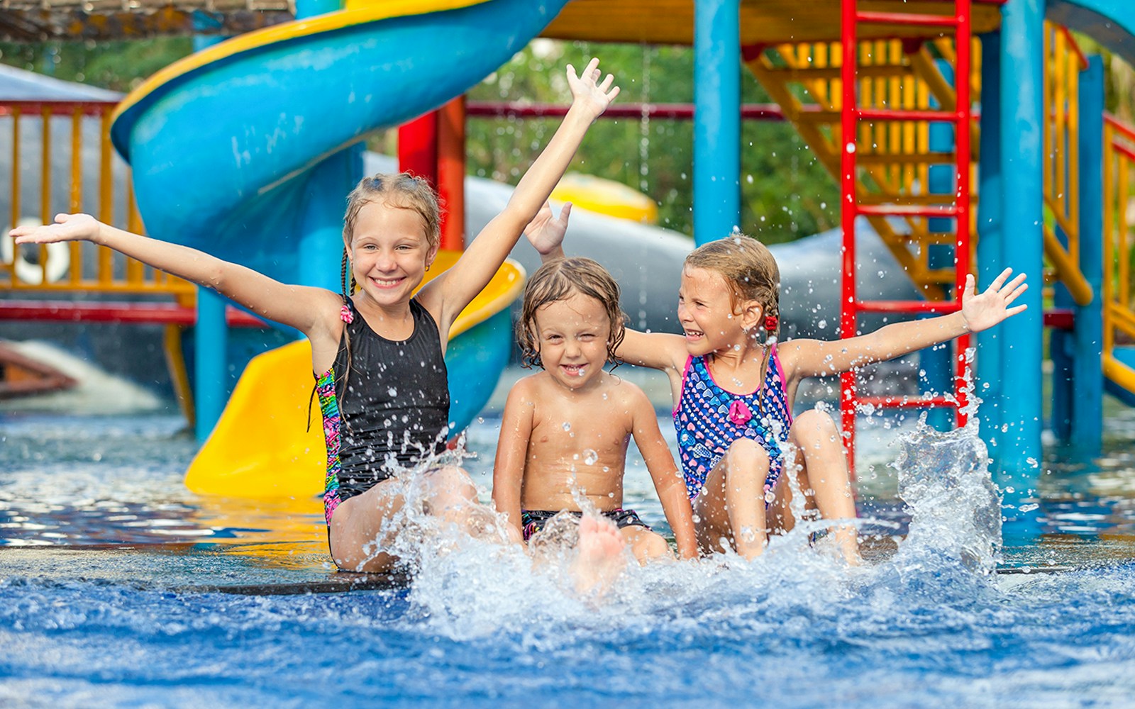 Children enjoying water slides