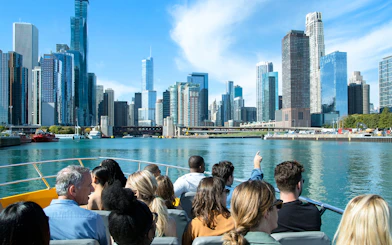Tourists on a boat viewing Chicago skyline during Sea Dog Architecture Cruise.