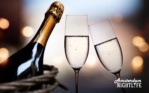 Champagne bottle and glasses for Amsterdam nightlife cruise experience.
