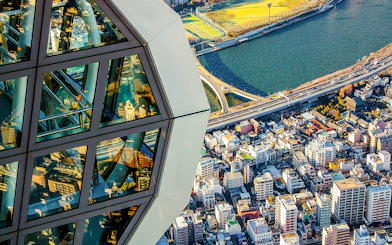 View from Tokyo Skytree overlooking cityscape and river.