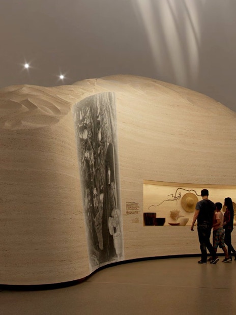Visitors exploring exhibits at Zayed National Museum, Abu Dhabi.