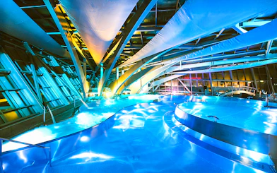 Caldea spa interior with illuminated pools and modern architecture in Andorra.