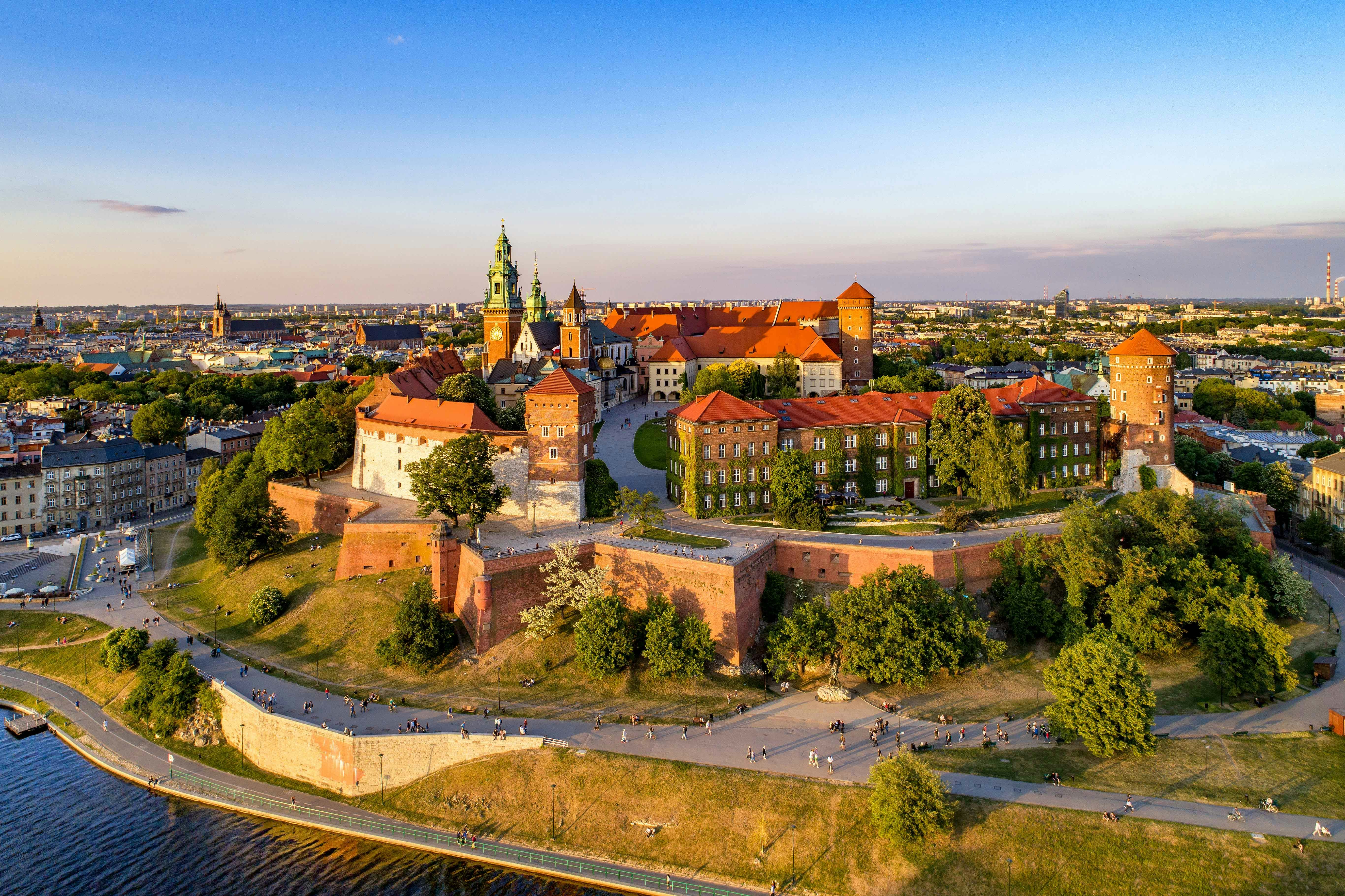 Aerial view of Krakow's Wawel Cathedral and Castle with surrounding greenery.