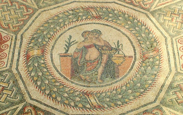 Mosaic detail from Villa Romana del Casale depicting a couple in an embrace.