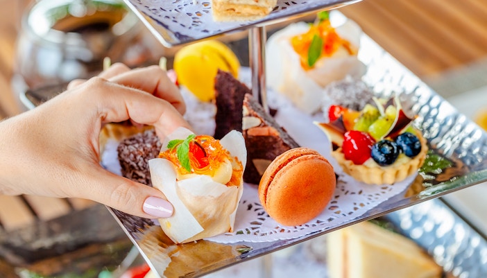 Assorted pastries on a tiered stand at Orbit revolving restaurant, Kuala Lumpur.