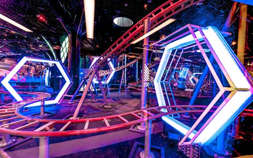 Roller coaster track with neon lights at Doha Quest Theme Park.