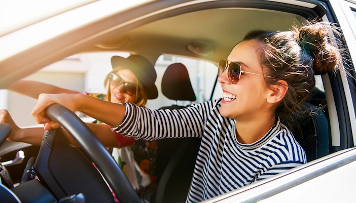 women driving car
